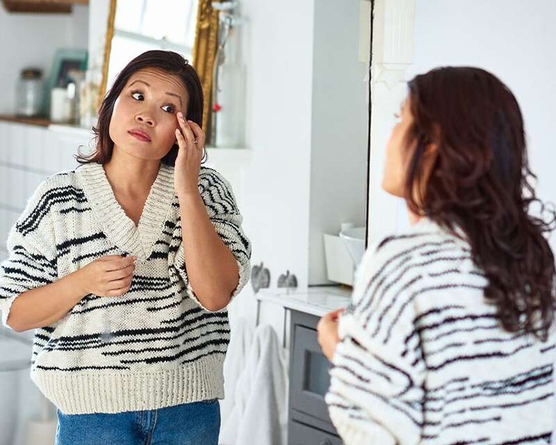 asian woman in the mirror